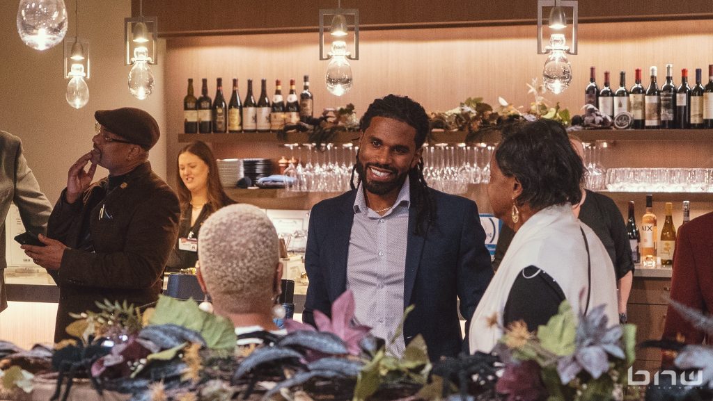 Washington State Department of Treasury Community Outreach Director, Jesse Johnson speaks with attendees at the BECO 2024 Fall Mixer.