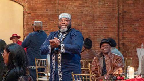 Attendee Tomahawk Pearson speaks at the BECO 2024 Holiday Mixer Event at The Bindery in Tacoma, WA. Photo by Larry Dominico for Brave New World Enterprises.